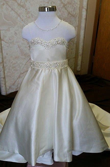 Flower girl beaded illusion sweetheart neckline, beaded sash & train.